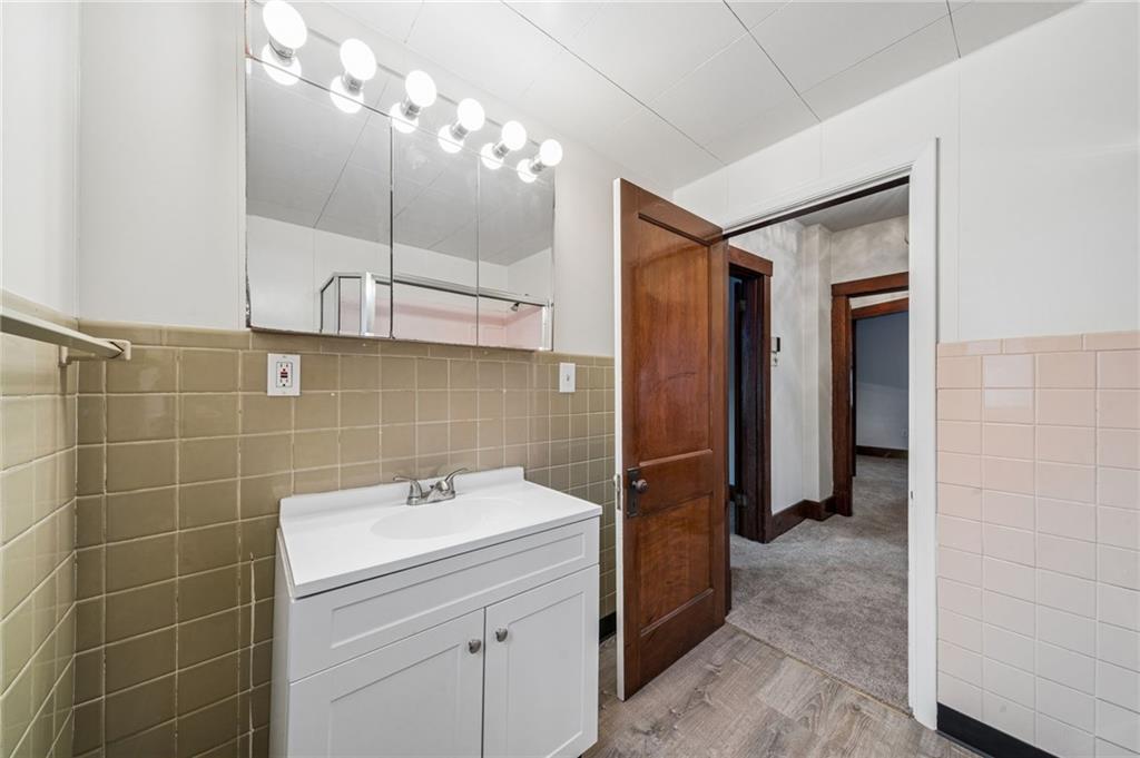620 Broadway Avenue McKees Rocks, PA 15136 - Photo 12 of 18 a bathroom with a sink a toilet and shower