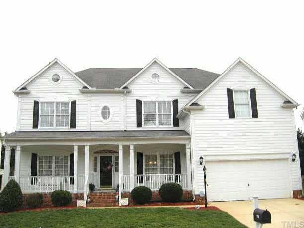 9116 Breeland Way Raleigh, NC 27613 - Photo 1 of 12 a front view of a house with a yard