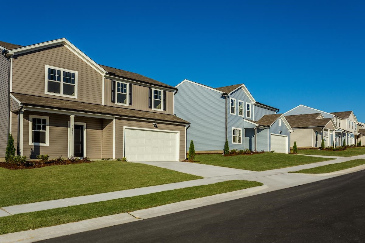 3424 Dragonfly River Raleigh, NC 27604 - Photo 2 of 28 a front view of a house with a yard