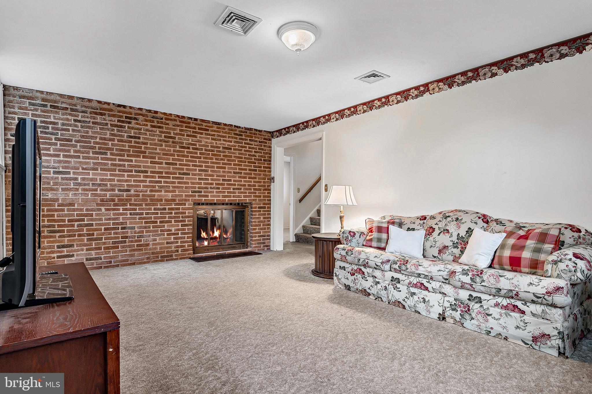 4802 Virginia Road Mechanicsburg, PA 17050 - Photo 21 of 30 Cozy lower level family room with fireplace