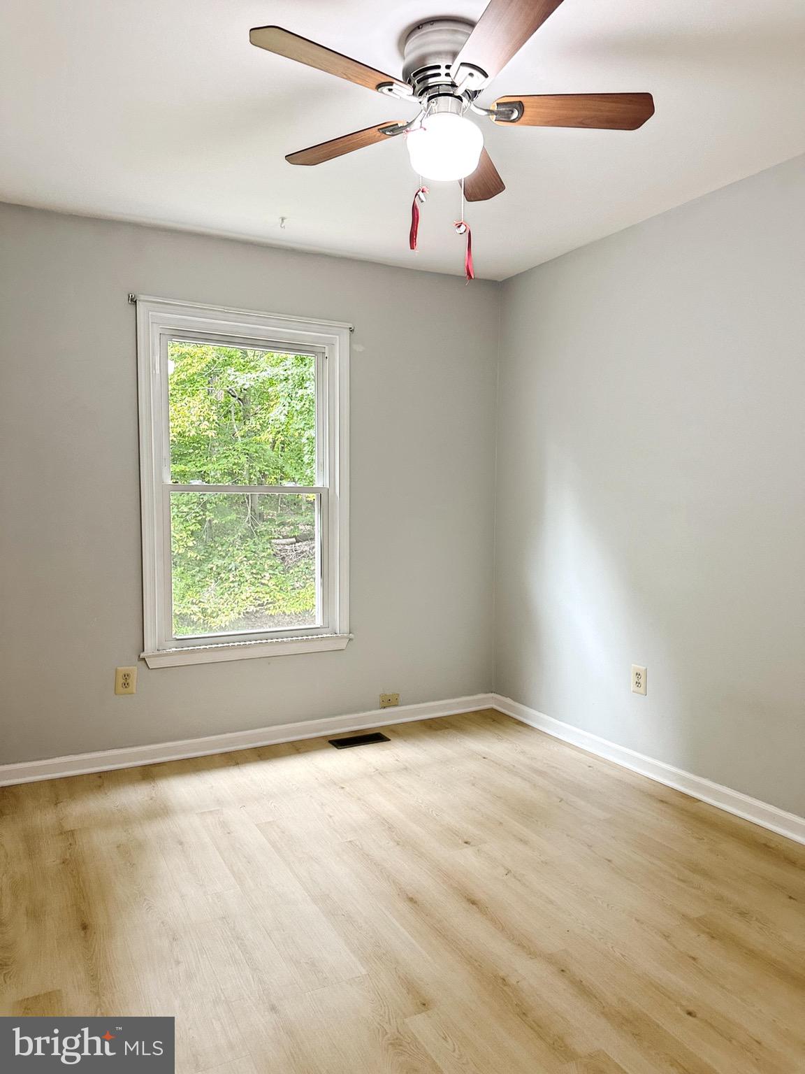 6260 Rathlin Drive Springfield, VA 22152 - Photo 13 of 27 an empty room with a window and a fan