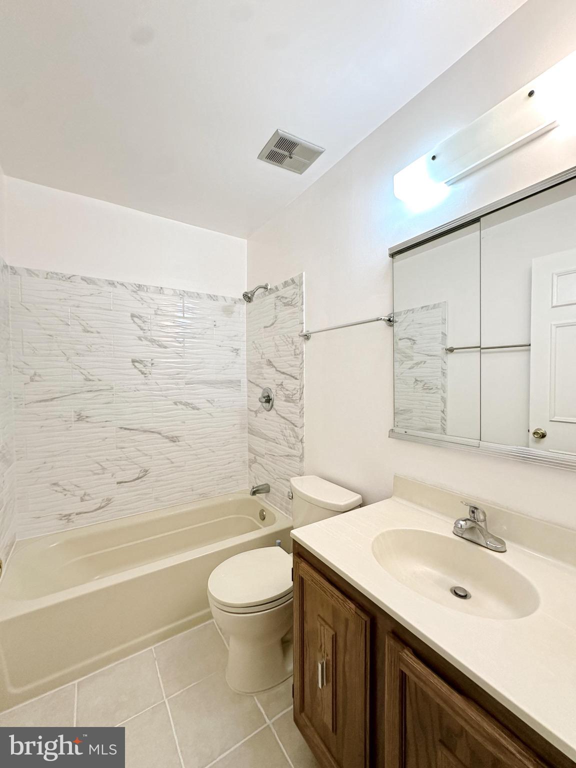 6260 Rathlin Drive Springfield, VA 22152 - Photo 15 of 27 a bathroom with a sink a toilet and shower