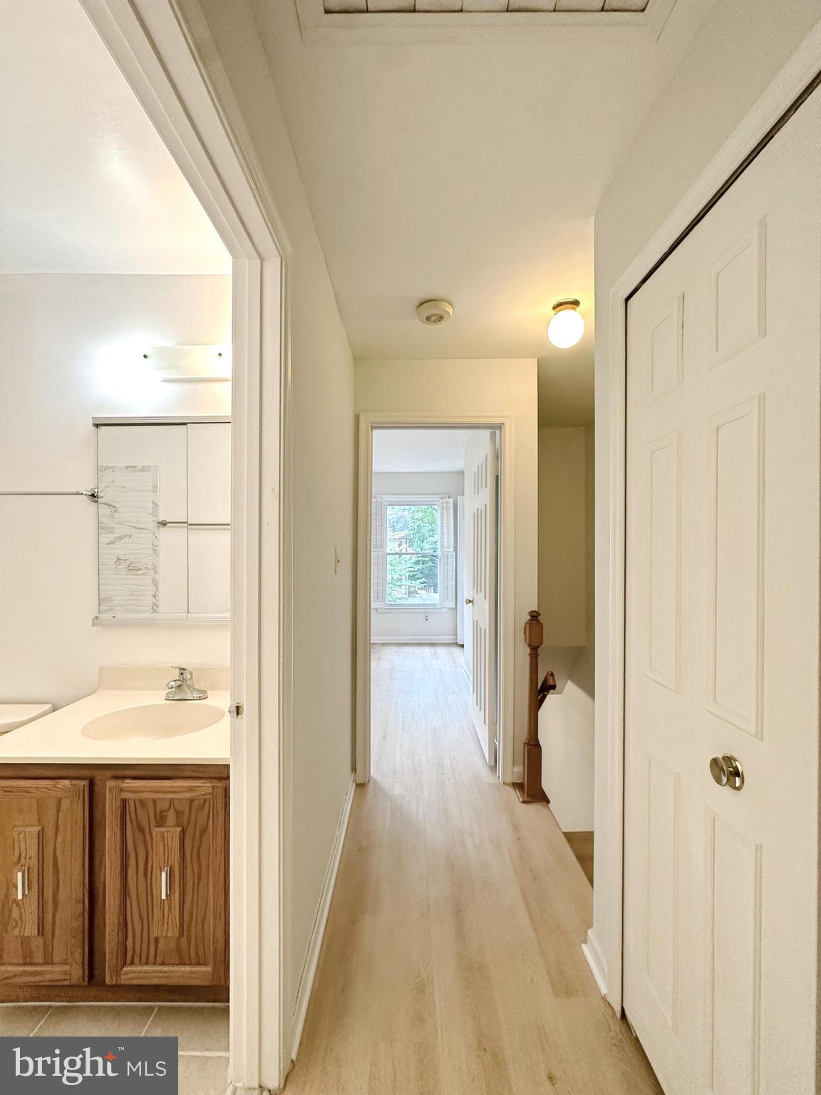 6260 Rathlin Drive Springfield, VA 22152 - Photo 19 of 27 a view of a bathroom with a tub shower and a sink