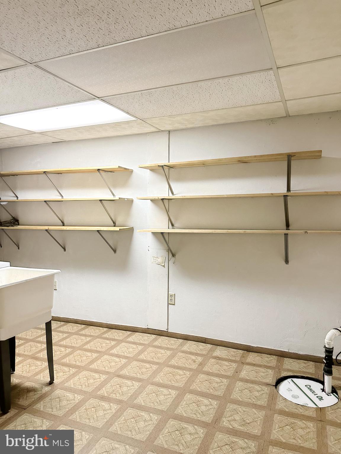 6260 Rathlin Drive Springfield, VA 22152 - Photo 23 of 27 a view of a room with shelves