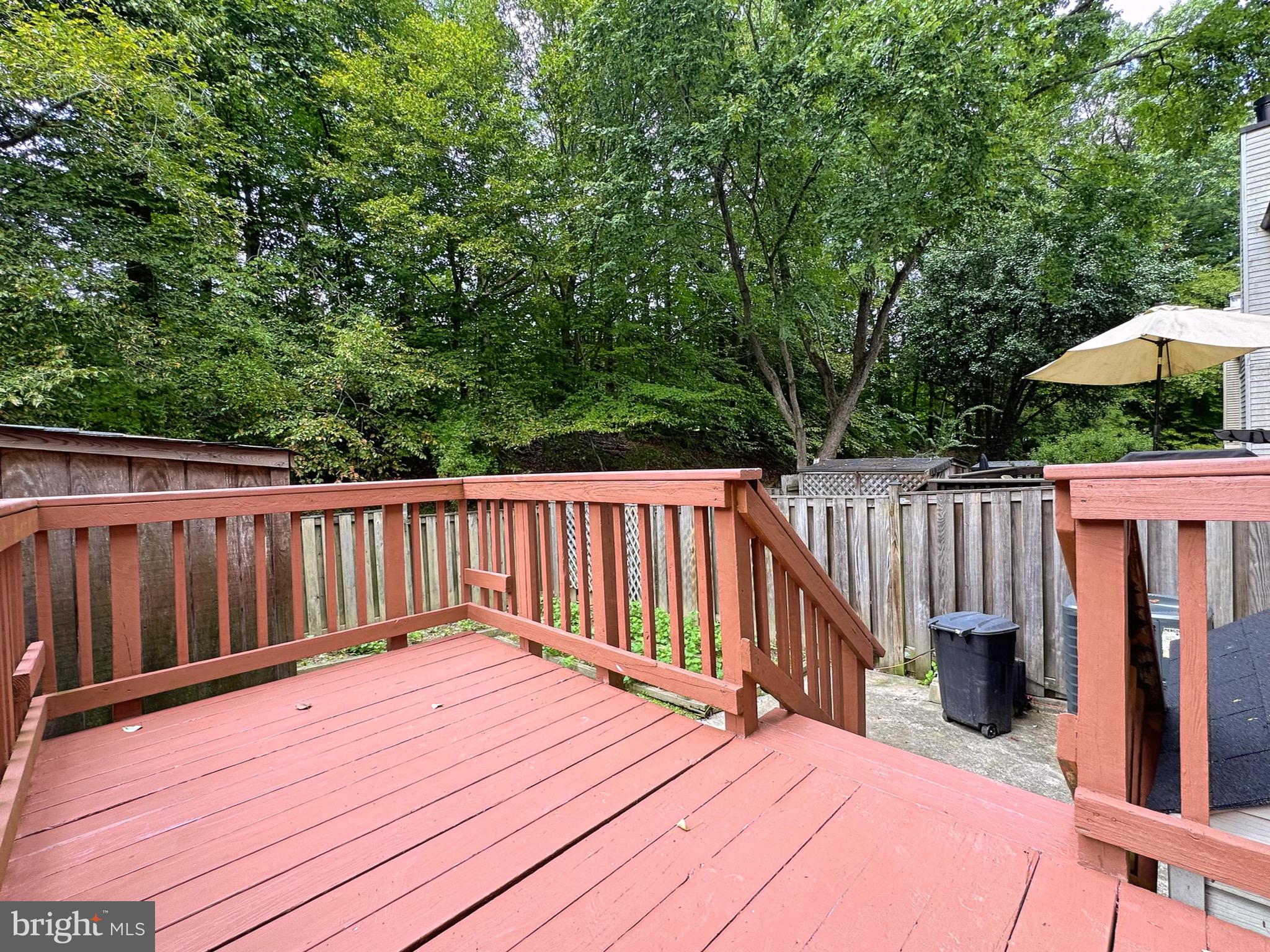 6260 Rathlin Drive Springfield, VA 22152 - Photo 25 of 27 a view of balcony with wooden floor and fence