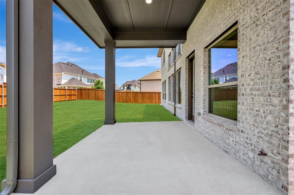 4308 Palomino Road Aubrey, TX 76227 - Photo 4 of 40 a view of a house with a yard