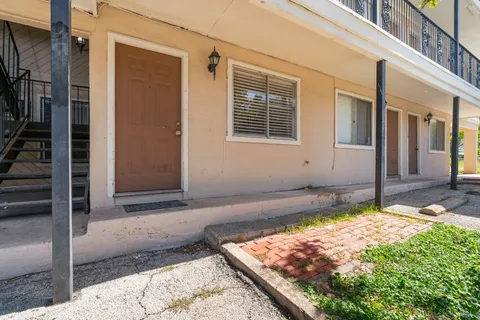 a view of a backyard of the house
