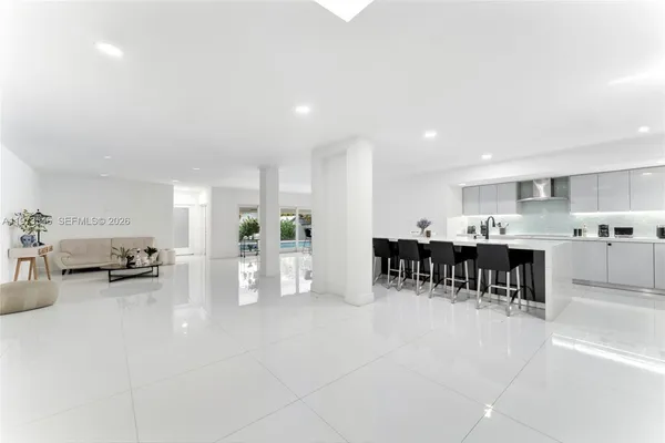 a kitchen with lots of counter top space and dining table