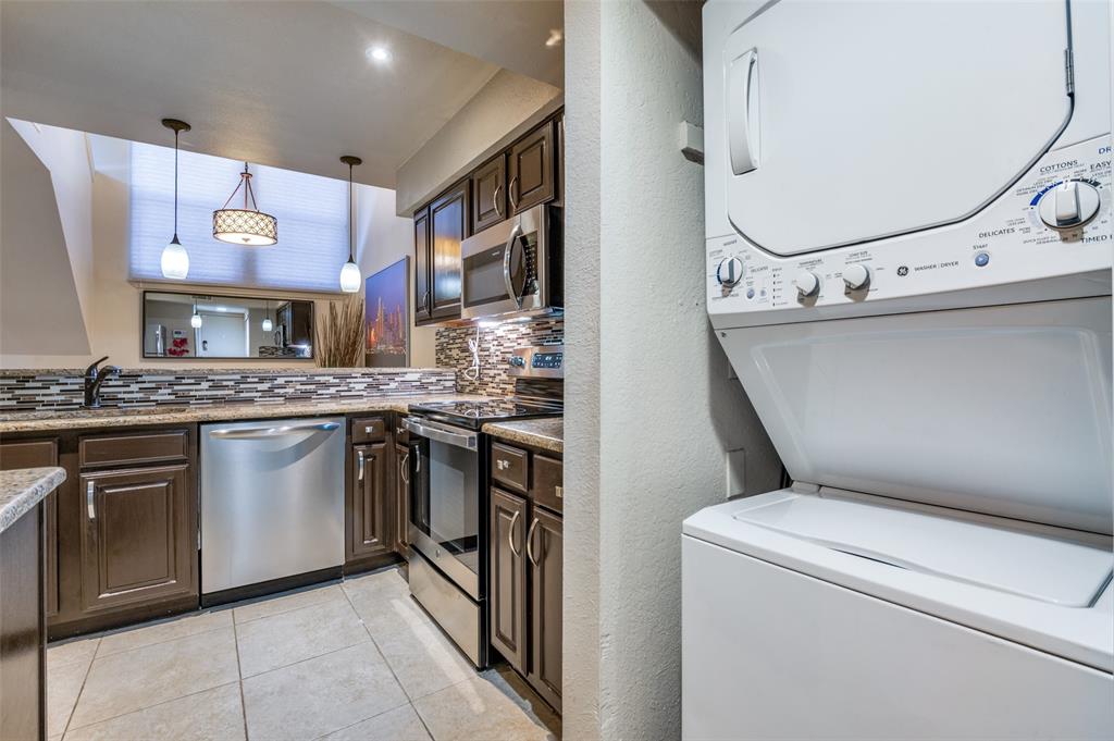 18240 Midway Road, Unit 1704 Dallas, TX 75287 - Photo 11 of 25 a kitchen with a stove and a sink