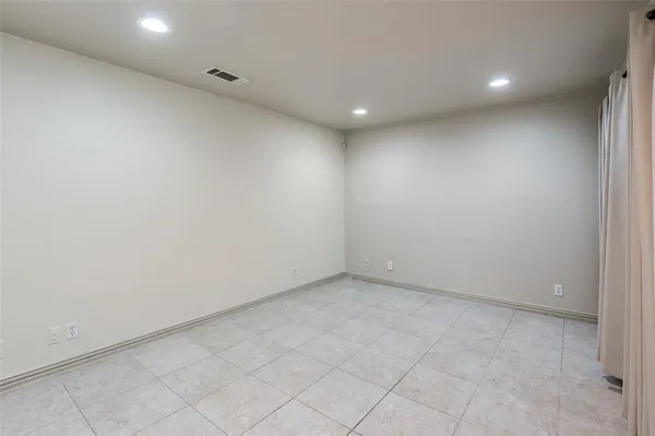 a bathroom with a granite countertop toilet sink and mirror