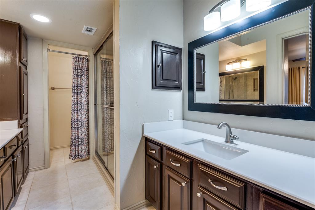 18240 Midway Road, Unit 1704 Dallas, TX 75287 - Photo 21 of 25 a bathroom with a sink double vanity and a mirror