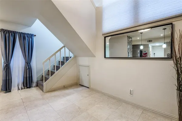 a view of staircase with hallway and stairs