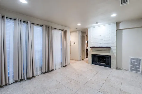 a view of kitchen with stainless steel appliances granite countertop living room