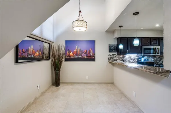 a kitchen with stainless steel appliances a stove sink microwave and cabinets