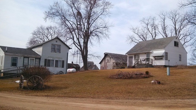 28189 Yonk Road Prophetstown, IL 61277 - Photo 1 of 10 a front view of a house with a yard and garage