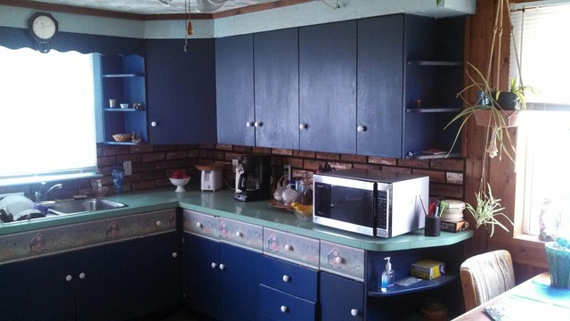 28189 Yonk Road Prophetstown, IL 61277 - Photo 3 of 10 a kitchen with stainless steel appliances granite countertop a stove and a microwave