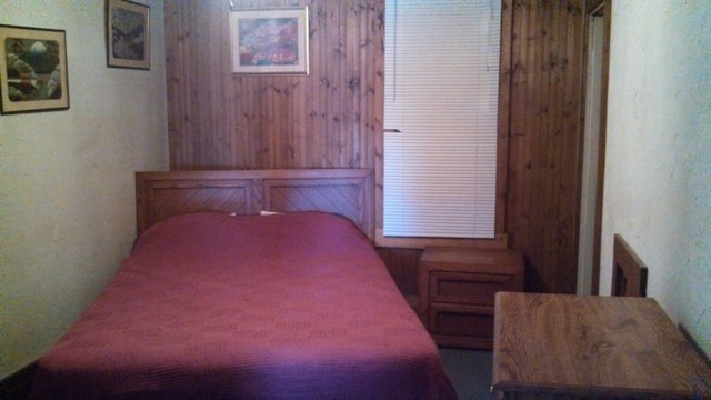 28189 Yonk Road Prophetstown, IL 61277 - Photo 6 of 10 a bedroom with a bed and mirror