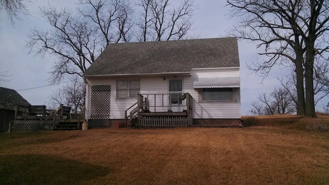 28189 Yonk Road Prophetstown, IL 61277 - Photo 7 of 10 a front view of a house with a yard