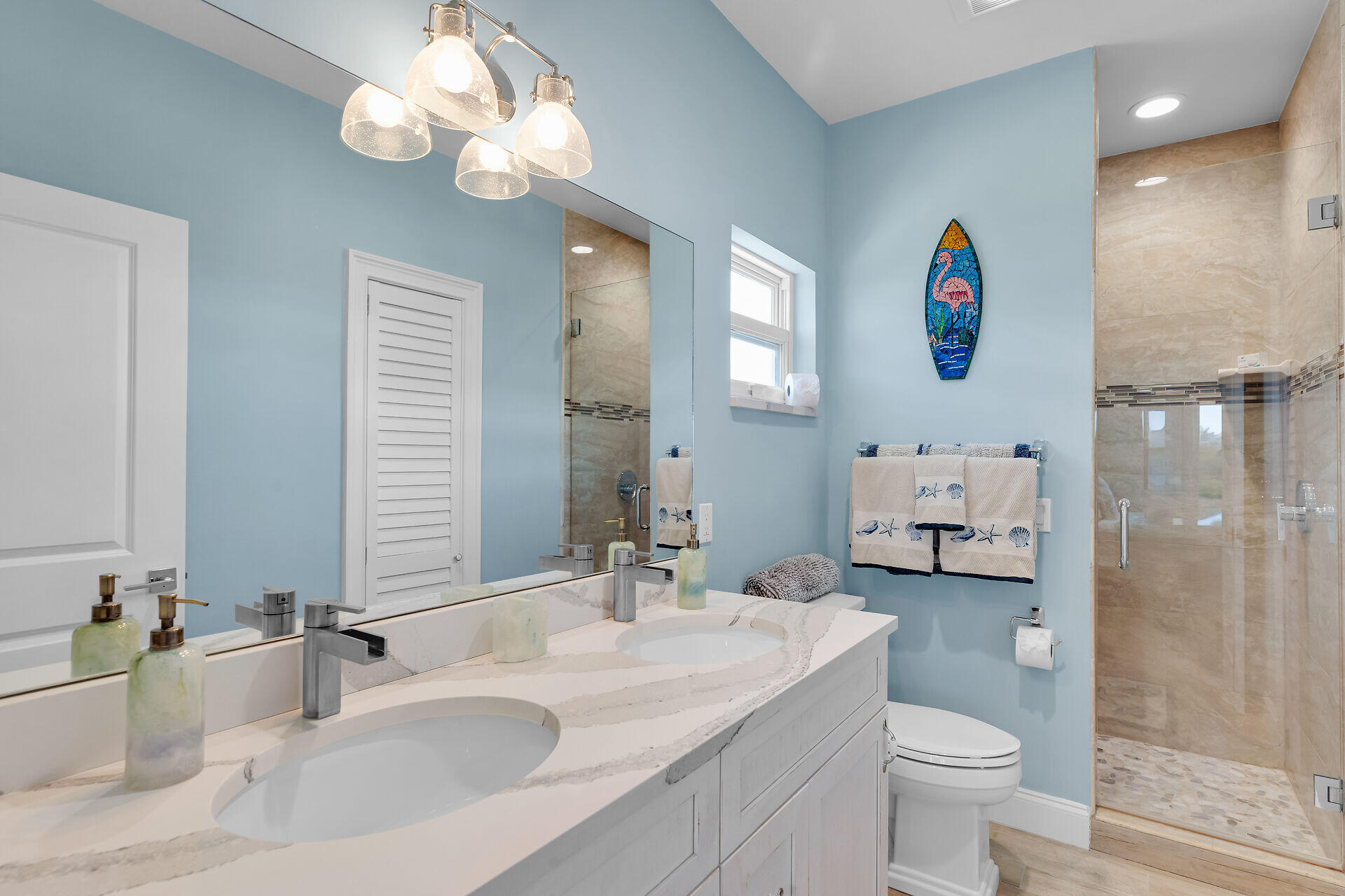 333 Indies Road Summerland Key, FL 33042 - Photo 33 of 66 a bathroom with a sink a toilet and a mirror