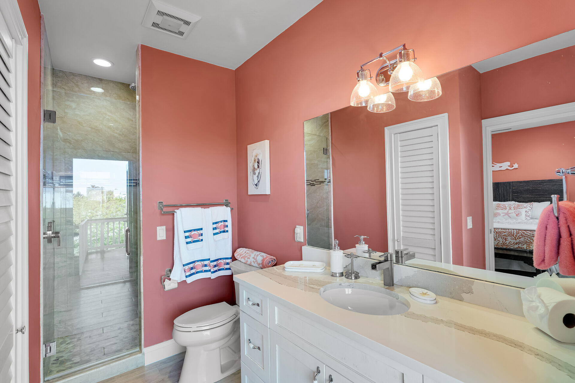 333 Indies Road Summerland Key, FL 33042 - Photo 35 of 66 a bathroom with a sink a toilet a shower and a mirror