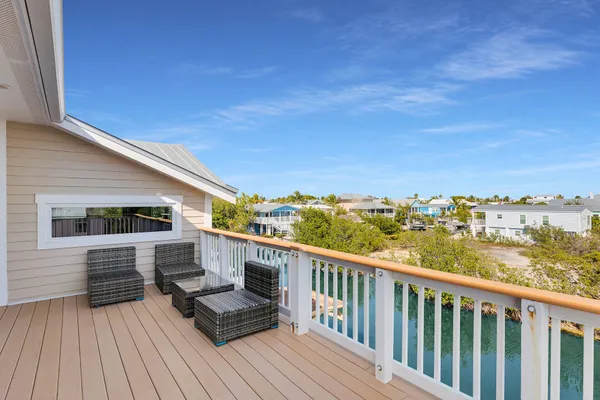 an aerial view of a house with a big yard and a large pool