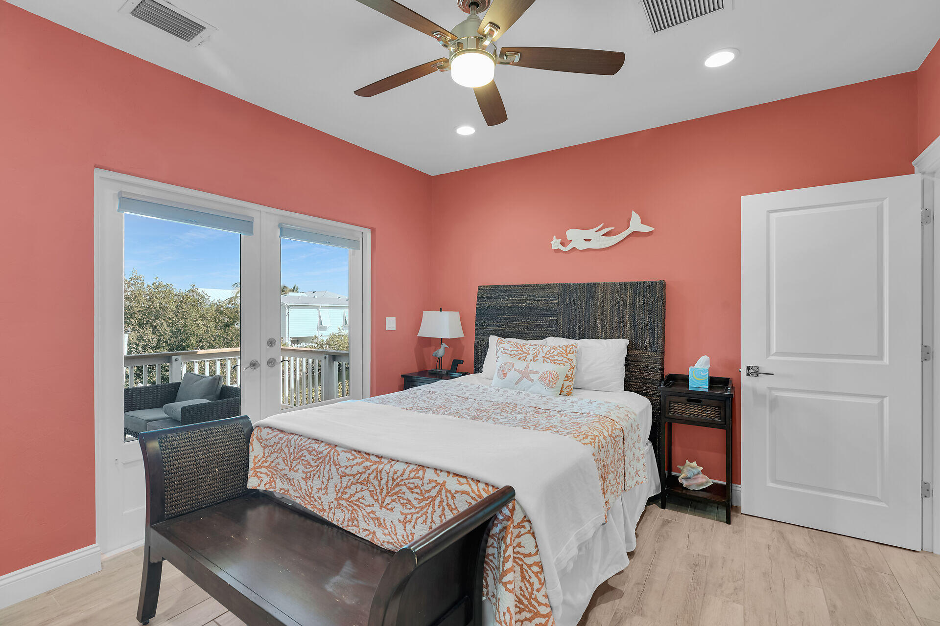 333 Indies Road Summerland Key, FL 33042 - Photo 53 of 66 a bedroom with a bed and a chandelier