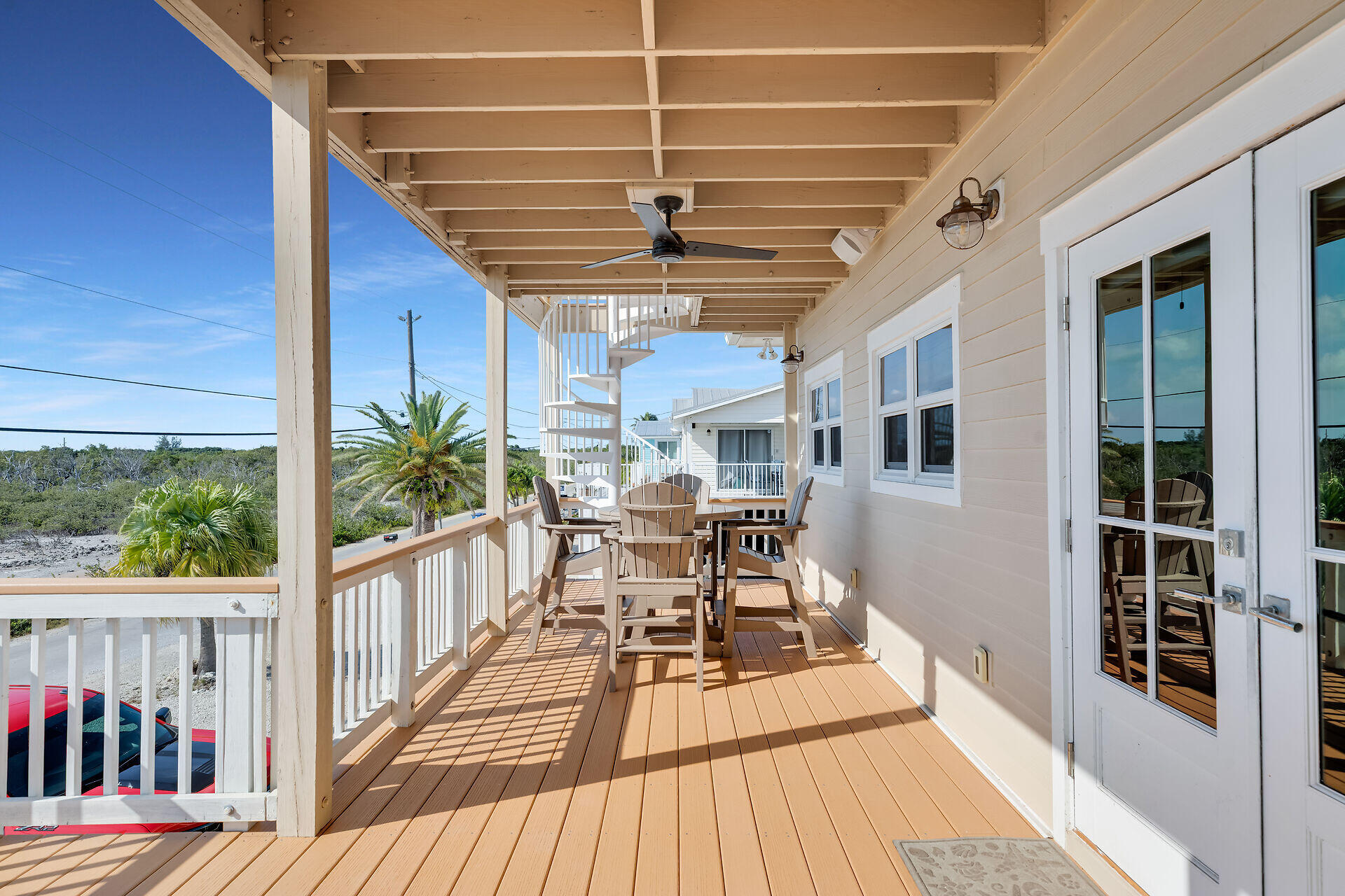 333 Indies Road Summerland Key, FL 33042 - Photo 59 of 66 a view of a patio with couches fire pit and wooden floor