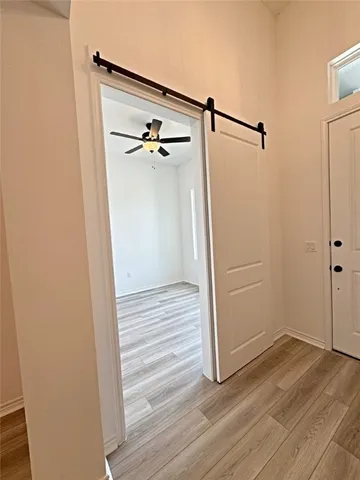 a view of closet area of a small space