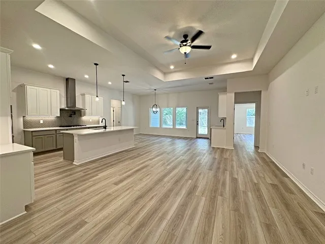 a view of kitchen with wooden floor and window