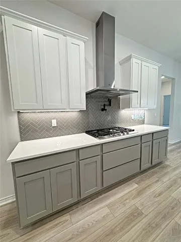 a kitchen with a sink cabinets and appliances