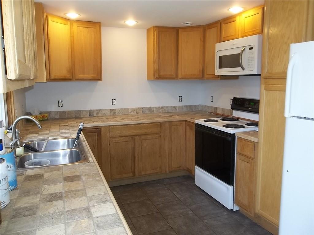 596 Patricktown Road Somerville, ME 04348 - Photo 2 of 12 Kitchen with Travertine marble tile...