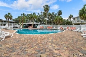 5291 South Cherokee Way Homosassa, FL 34448 - Photo 26 of 27 a view of a swimming pool with a yard