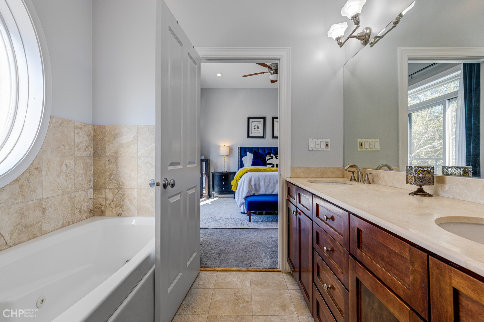 4603 North Racine Avenue, Unit 201 Chicago, IL 60640 - Photo 18 of 33 a spacious bathroom with a tub sink and mirror