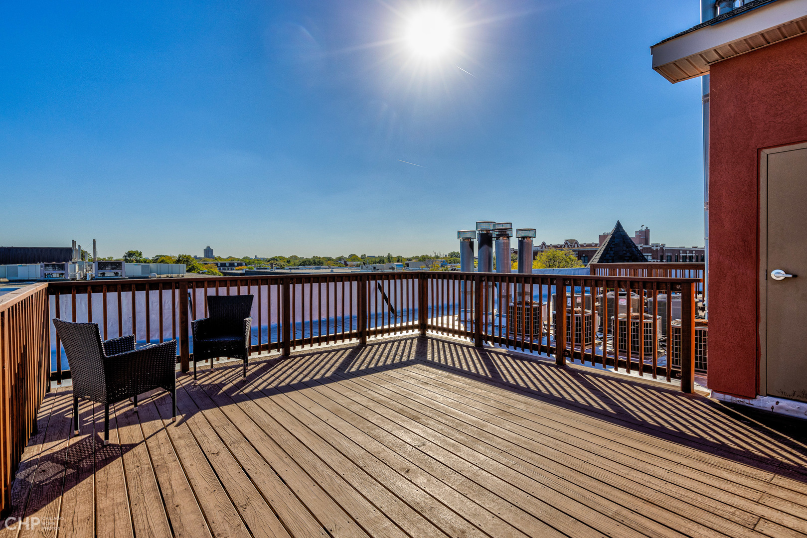 4603 North Racine Avenue, Unit 201 Chicago, IL 60640 - Photo 32 of 33 a view of wooden balcony with two chairs and a table