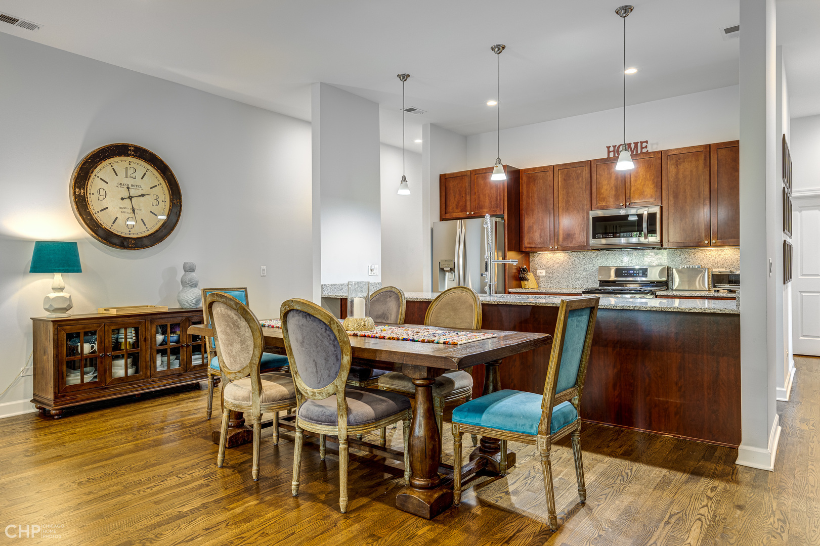 4603 North Racine Avenue, Unit 201 Chicago, IL 60640 - Photo 8 of 33 a view of a dining room with furniture and wooden floor