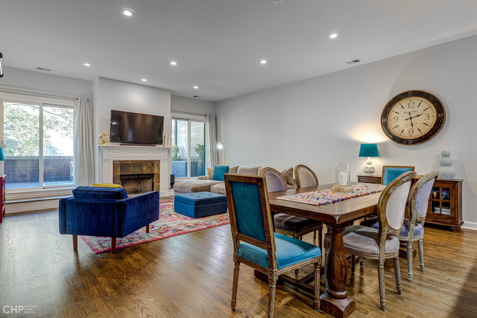 4603 North Racine Avenue, Unit 201 Chicago, IL 60640 - Photo 9 of 33 a view of a dining room with furniture a fireplace and wooden floor