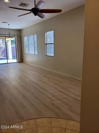 a view of a room with window and wooden floor