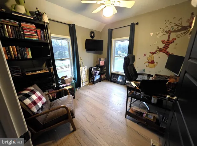 a living room with furniture fireplace and a flat screen tv