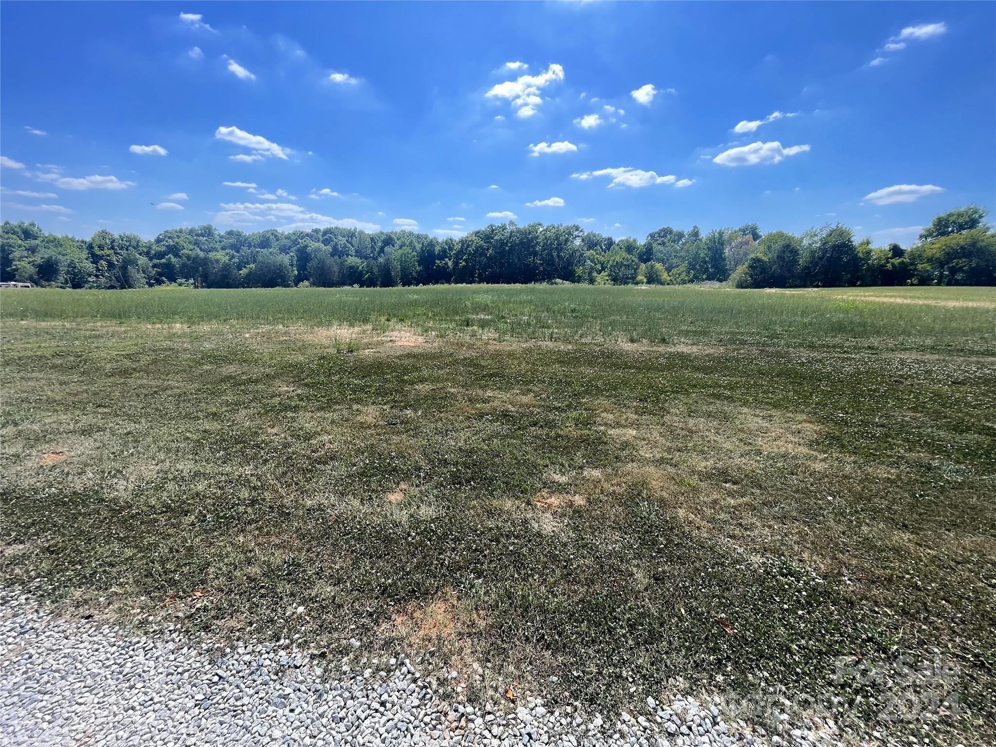 Lot 2 Shinn Road Mount Ulla, NC 28125 - Photo 3 of 5 a view of a big yard with a house in the background
