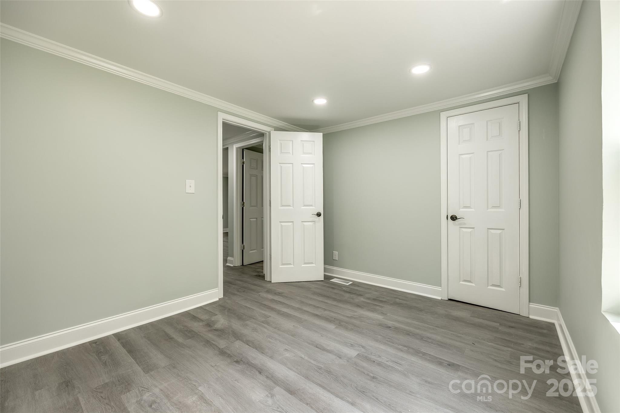 1224 Martin Road Hickory Grove, SC 29717 - Photo 15 of 40 an empty room with wooden floor and closet area