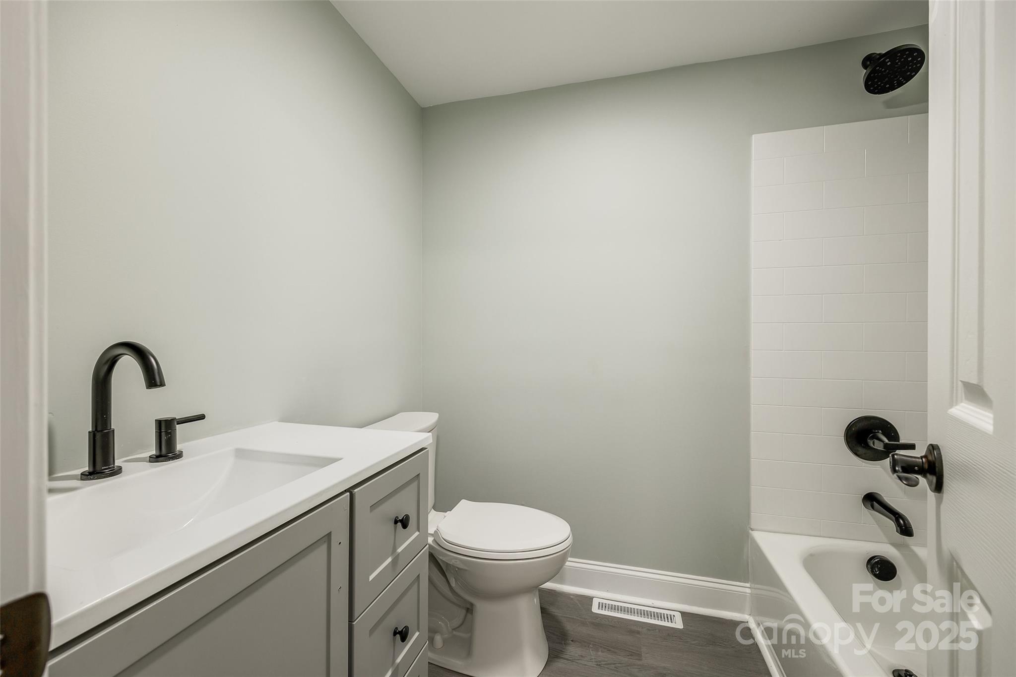 1224 Martin Road Hickory Grove, SC 29717 - Photo 18 of 40 a bathroom with a sink a toilet and a tub