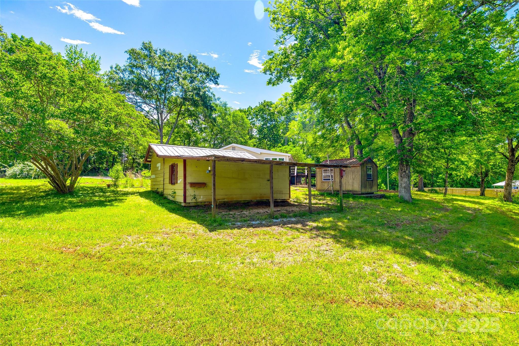 1224 Martin Road Hickory Grove, SC 29717 - Photo 2 of 40 a view of a house with backyard and garden