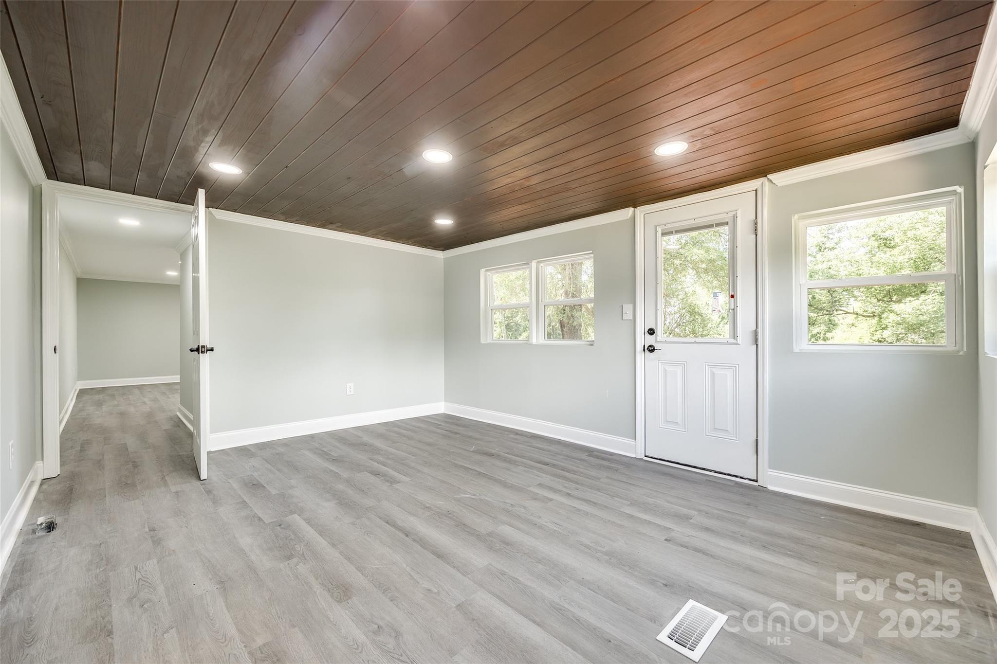 1224 Martin Road Hickory Grove, SC 29717 - Photo 24 of 40 an empty room with wooden floor and windows