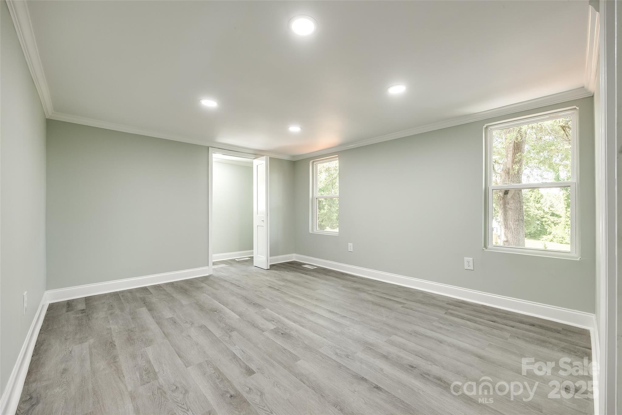 1224 Martin Road Hickory Grove, SC 29717 - Photo 27 of 40 an empty room with wooden floor and windows