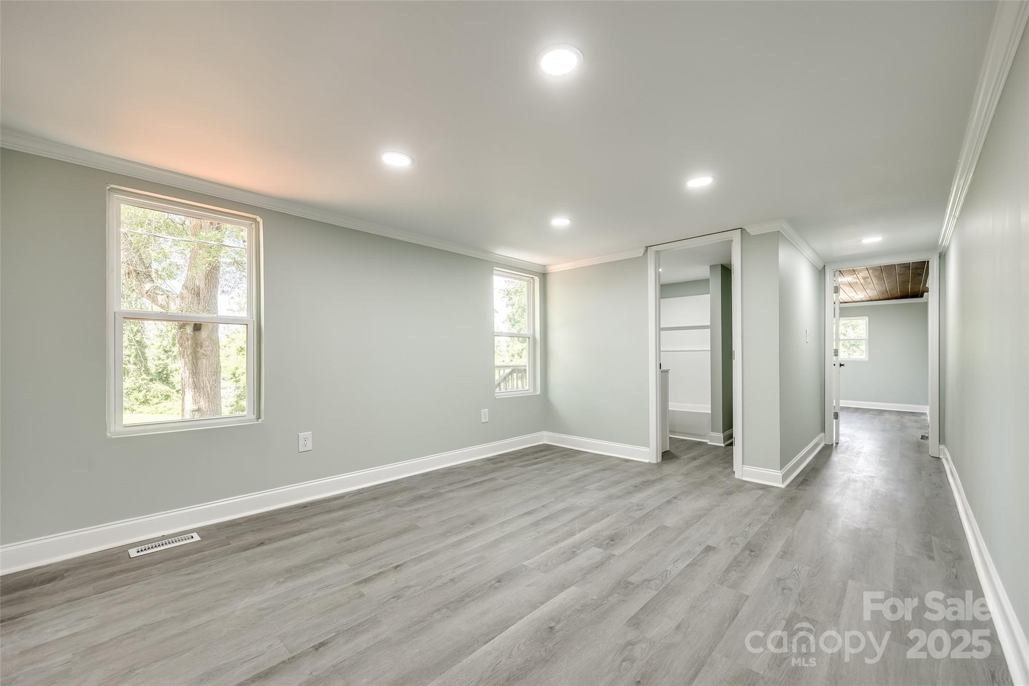1224 Martin Road Hickory Grove, SC 29717 - Photo 28 of 40 an empty room with wooden floor and windows