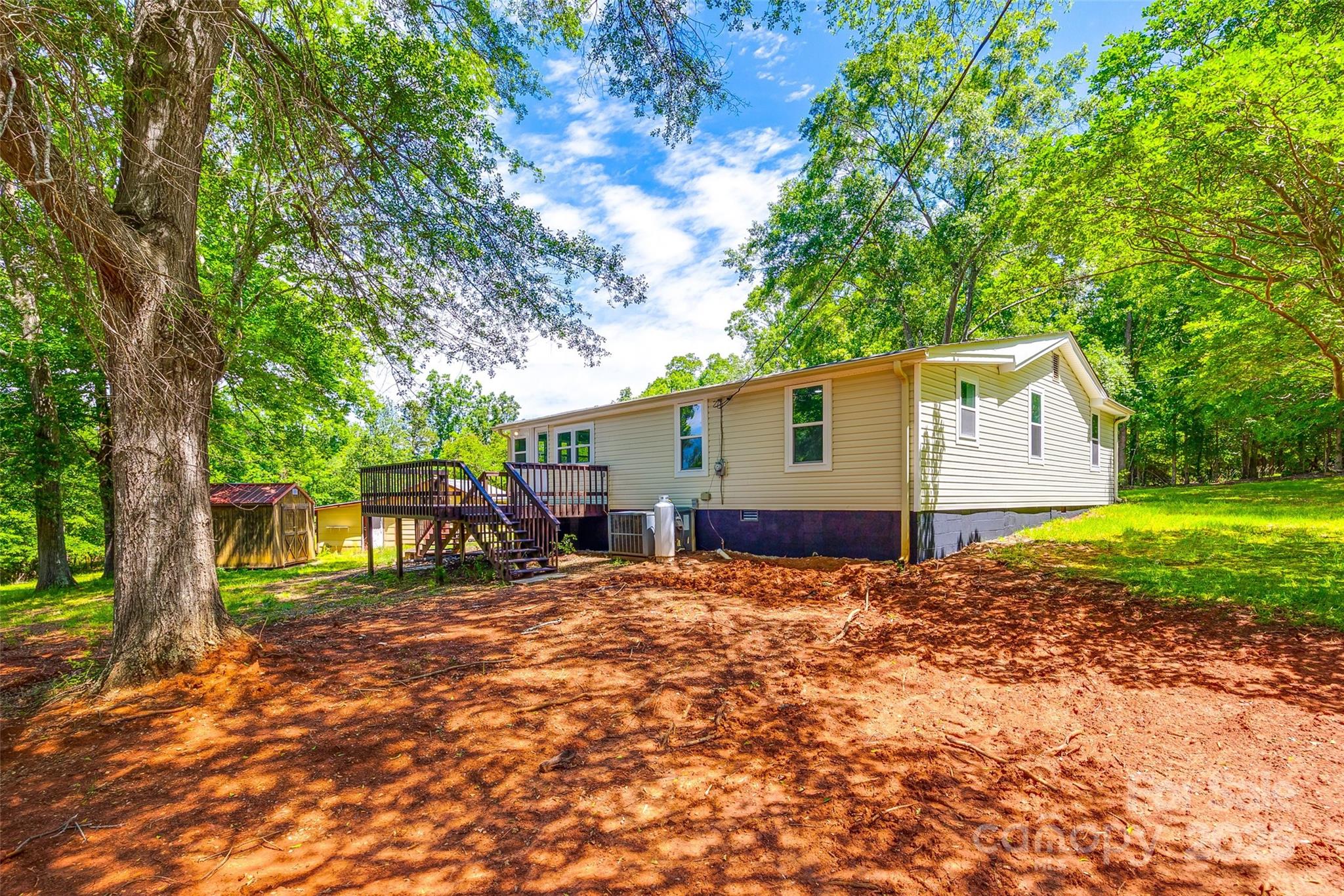 1224 Martin Road Hickory Grove, SC 29717 - Photo 34 of 40 a backyard of a house with yard and outdoor seating