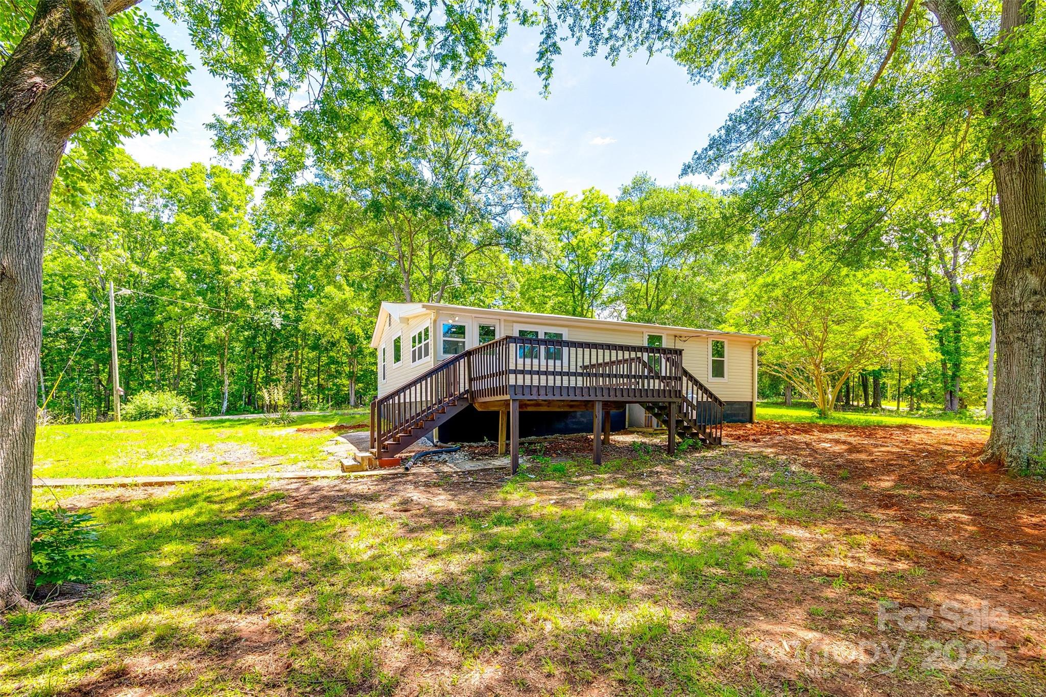1224 Martin Road Hickory Grove, SC 29717 - Photo 36 of 40 a view of a house with a yard patio and fire pit