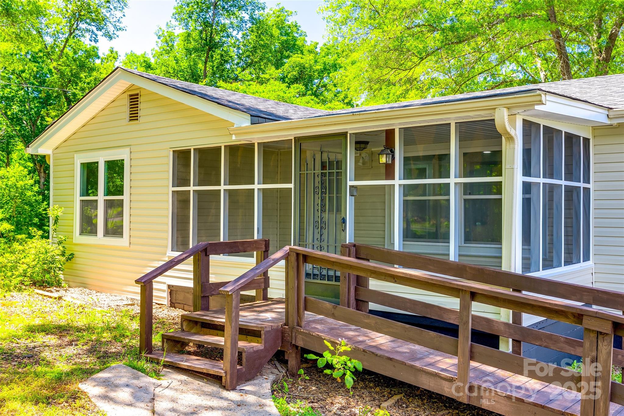 1224 Martin Road Hickory Grove, SC 29717 - Photo 5 of 40 a view of a house with a large window and a chair
