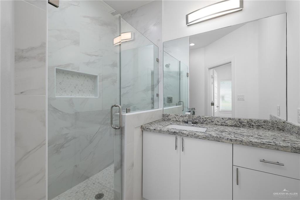 901 East Yuma Avenue, Unit 1901 McAllen, TX 78503 - Photo 9 of 9 Full bath with a marble finish shower and vanity