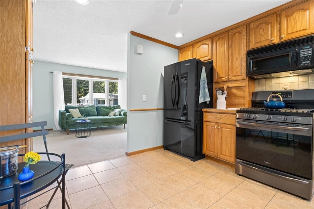 83 Brookside Road Rockland, MA 02370 - Photo 11 of 31 a kitchen with refrigerator and cabinets